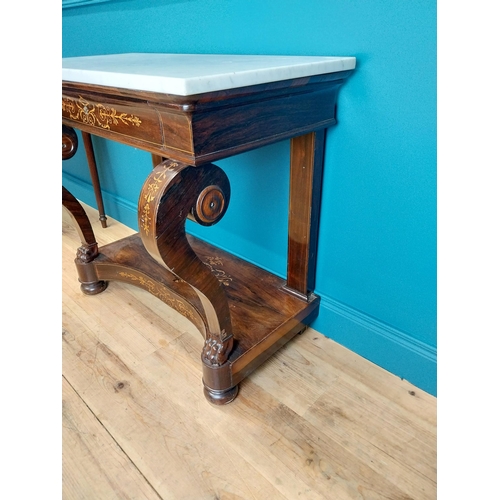 121 - William IV rosewood and satinwood inlaid consul table with marble top and single drawer in the friez... 