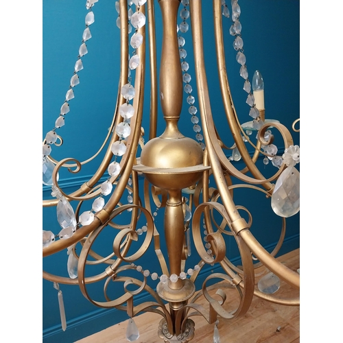 124 - Good quality gilded metal ten branch chandelier with cut crystal droplets in the Rocco manner {138 c... 