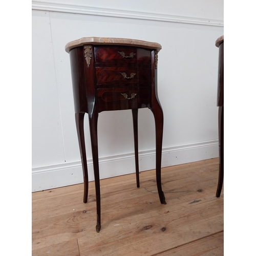 128 - Pair of mahogany inlaid oval bedside cabinets with marble tops raised on serpentine legs {72 cm H x ... 