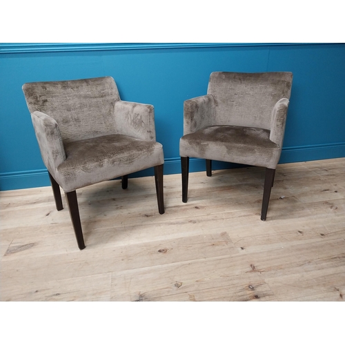 129 - Pair of good quality restaurant armchairs with crushed velvet upholstery raised on mahogany square t... 