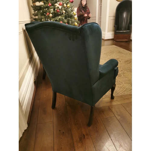 149 - Pair of green velvet upholstered wingback armchairs {110cm H x 79cm W x 85cm D}