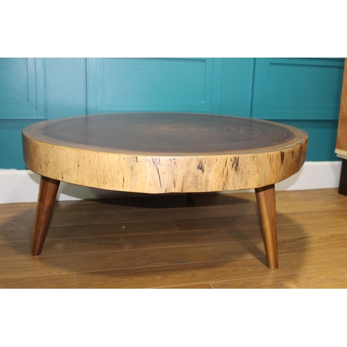 Tree top coffee table raised on splayed legs {H 48cm x Dia 115cm}.