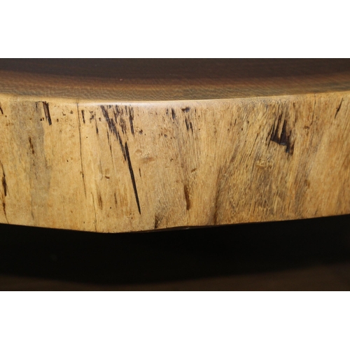 Tree top coffee table raised on splayed legs {H 48cm x Dia 115cm}.