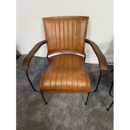 160 - Pair of leather and steel designer armchairs.