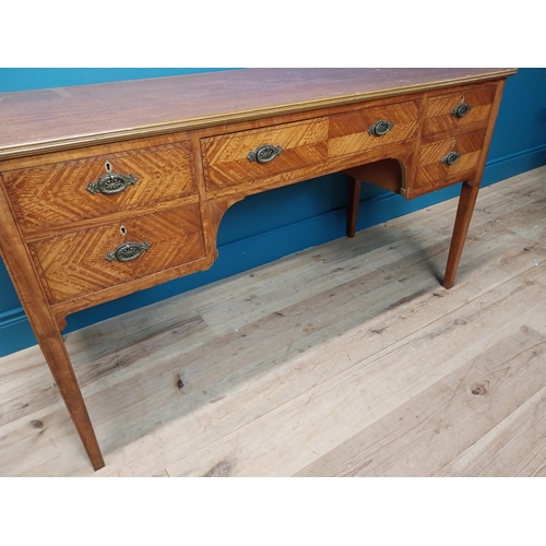 163 - Edwardian satinwood and inlaid desk with central drawer flanked by four short drawers on tapered leg... 
