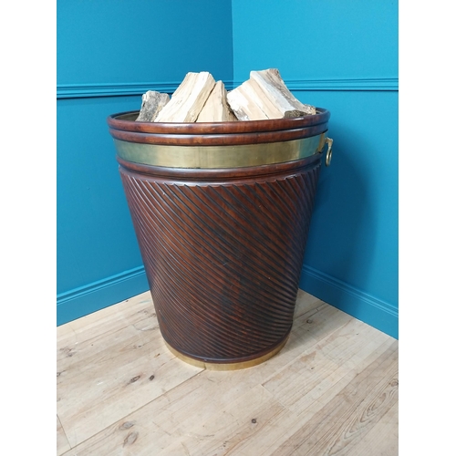 169 - Exceptional quality Irish brass bound spiralled mahogany Estate peat bucket in the Georgian manner {... 