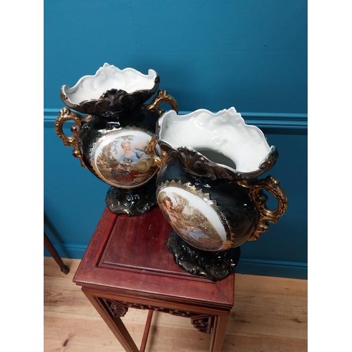 177 - Pair of 19th C. hand painted ceramic vases with gilded decoration. {32 cm H  x 22 cm W x 12 cm D}