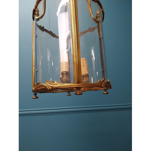 188 - Good quality 19th C. gilded brass and glass hall lantern in the Rocco manner {56 cm H x 27 cm Dia.}.