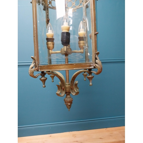 189 - Good quality decorative brass hall lantern with etched curved glass panels {105 cm H x 35 cm Dia.}.