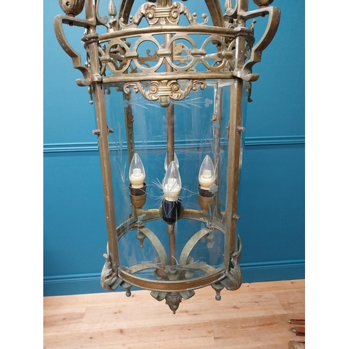 189 - Good quality decorative brass hall lantern with etched curved glass panels {105 cm H x 35 cm Dia.}.