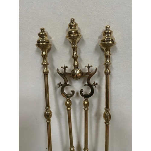 196 - Set of three brass fire irons and brass fire dogs.