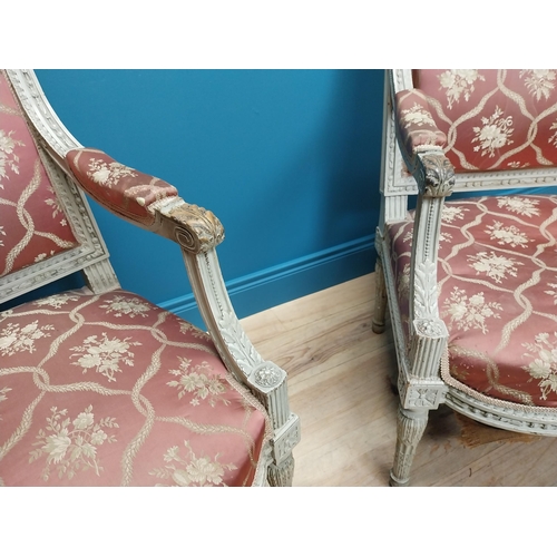 216 - Pair of 19th C. French open armchairs with carved pine frames and upholstered seats on reeded legs {... 