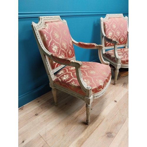 216 - Pair of 19th C. French open armchairs with carved pine frames and upholstered seats on reeded legs {... 