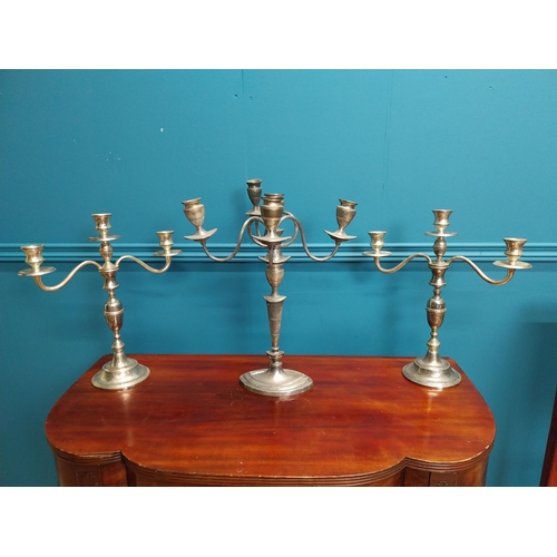 228 - Three silverplate candelabras {42cm H x 33cm W and 38cm H x 35cm W}