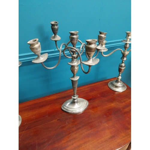 228 - Three silverplate candelabras {42cm H x 33cm W and 38cm H x 35cm W}