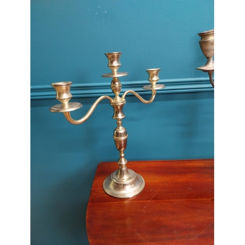 228 - Three silverplate candelabras {42cm H x 33cm W and 38cm H x 35cm W}