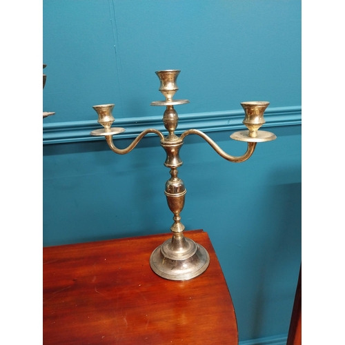 228 - Three silverplate candelabras {42cm H x 33cm W and 38cm H x 35cm W}