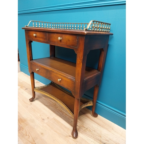 229 - Good quality walnut side table with brass gallery back on pad feet {85 cm H x 70 cm W x 36 cm D}