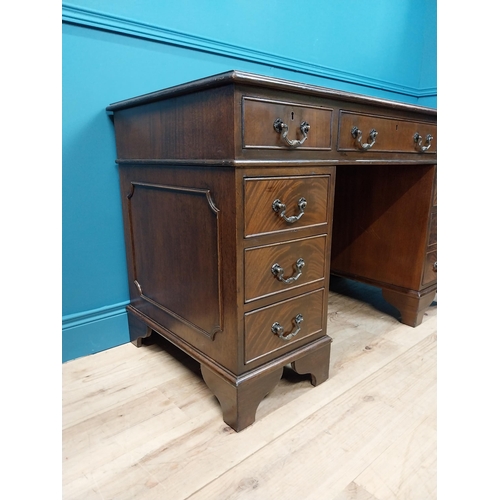 233 - Good quality mahogany pedestal desk with inset leather top and brass handles raised on bracket feet ... 