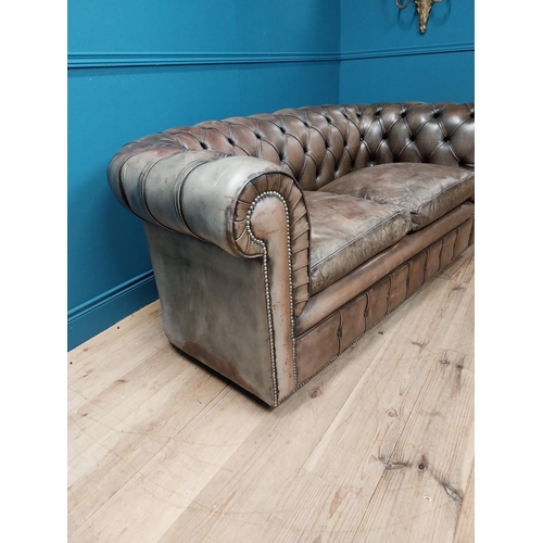 236 - Hand dyed leather deep buttoned two seater Chesterfield sofa {73 cm H x 167 cm W x 85 cm D}.