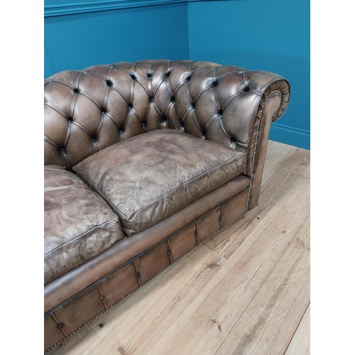 236 - Hand dyed leather deep buttoned two seater Chesterfield sofa {73 cm H x 167 cm W x 85 cm D}.