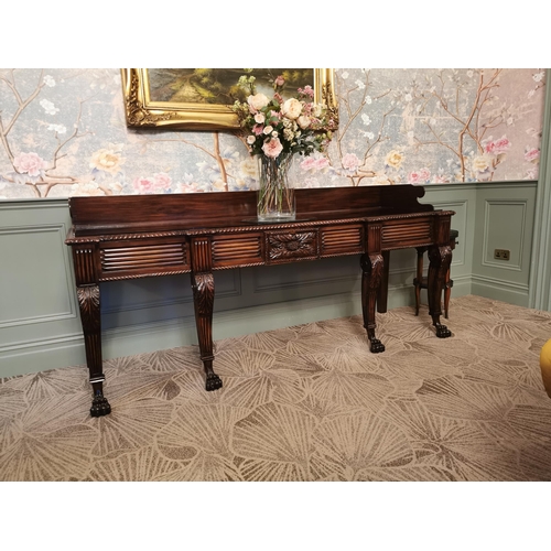 241 - Irish Regency mahogany consul table with gallery back and carved central panel raised on cabriole le... 