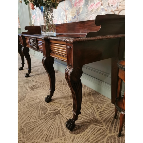 241 - Irish Regency mahogany consul table with gallery back and carved central panel raised on cabriole le... 