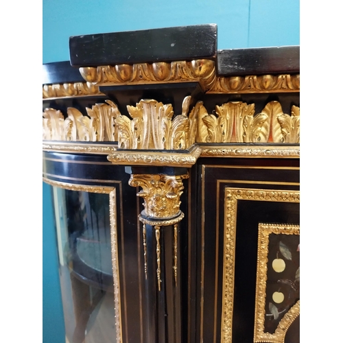 262 - 19th. C. ebonised rosewood inverted breakfront credenza, the cabinet ornately decorated with gilded ... 