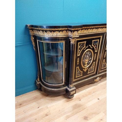 262 - 19th. C. ebonised rosewood inverted breakfront credenza, the cabinet ornately decorated with gilded ... 