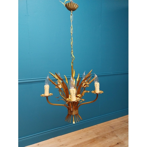 298 - Gilded metal Coco Chanel five branch chandelier with wheatsheaf decoration. {46 cm H x 38 cm Diam}.