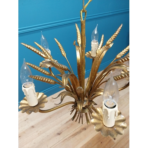 298 - Gilded metal Coco Chanel five branch chandelier with wheatsheaf decoration. {46 cm H x 38 cm Diam}.