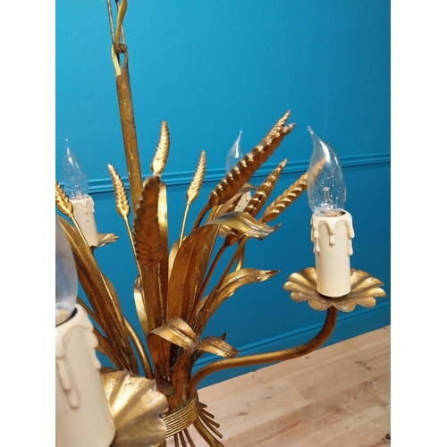 298 - Gilded metal Coco Chanel five branch chandelier with wheatsheaf decoration. {46 cm H x 38 cm Diam}.