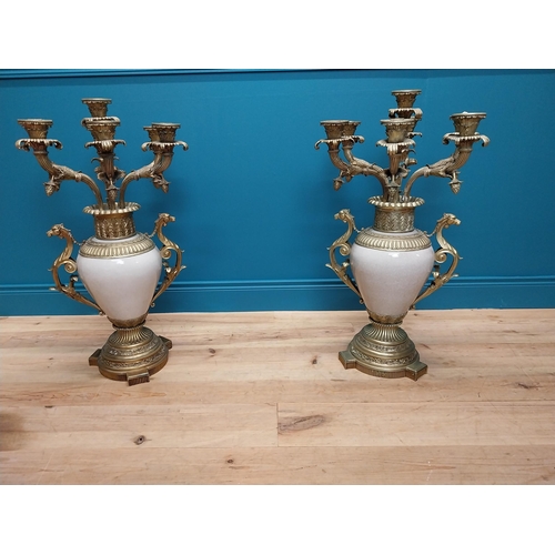 301 - Pair of exceptional quality gilded brass and ceramic seven branch candelabra {87 cm H x 49 cm Dia.}.