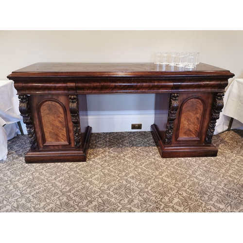 303 - 19th. C. carved mahogany pedestal sideboard the centre drawer flanked by two short drawers over two ... 