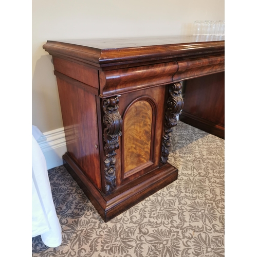 303 - 19th. C. carved mahogany pedestal sideboard the centre drawer flanked by two short drawers over two ... 