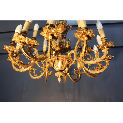 324 - French bronze nine branch chandelier decorated with acanthus leaf and cherubs {H 84cm x Dia 78cm}.