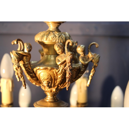 324 - French bronze nine branch chandelier decorated with acanthus leaf and cherubs {H 84cm x Dia 78cm}.