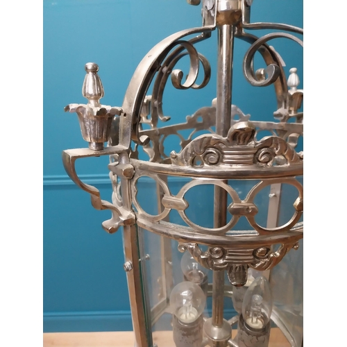 348 - Polished metal hall lantern with four lights { 68cm H X 80cm Dia }.