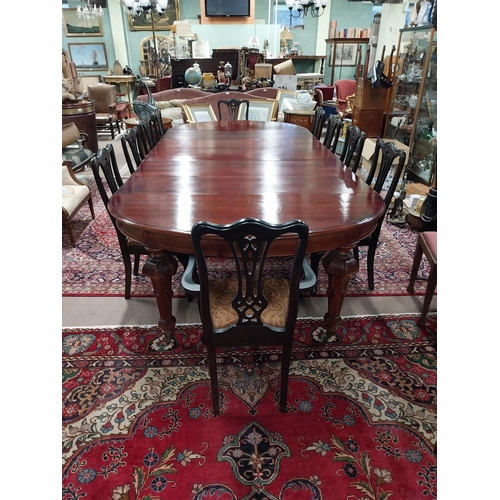 349 - 19th C. mahogany extendable dining table raised on fluted legs and brass castors with five leaves {8... 