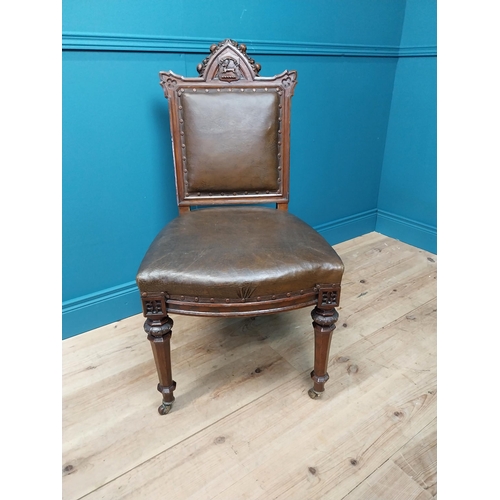 39 - 19th C. oak and leather upholstered side chair raised on reeded legs and brass castors {100 cm H x 5... 
