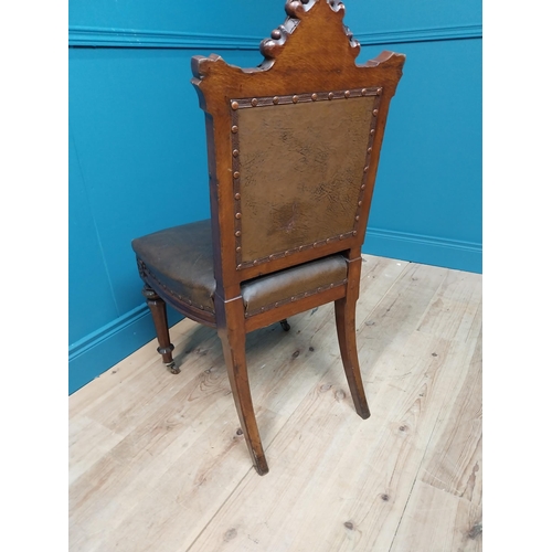 39 - 19th C. oak and leather upholstered side chair raised on reeded legs and brass castors {100 cm H x 5... 