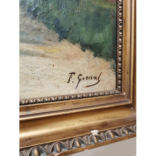 41 - F. Gerard Village scene oil on canvas mounted in giltwood frame {79 cm H x 97 cm W}.