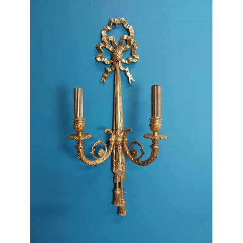 62 - Pair of good quality gilded brass two branch wall sconces {60 cm H x 23 cm W}.