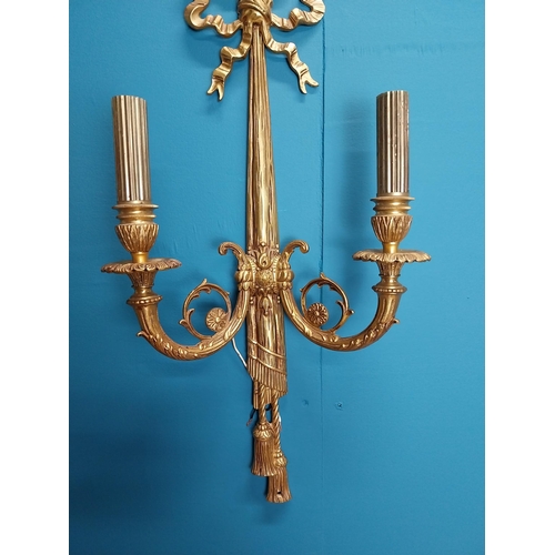62 - Pair of good quality gilded brass two branch wall sconces {60 cm H x 23 cm W}.