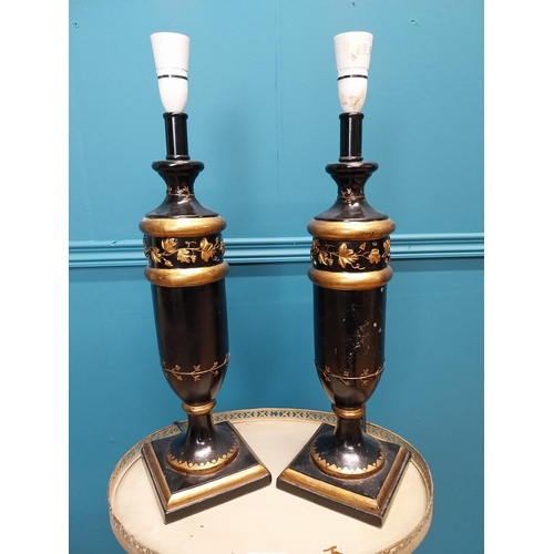 68 - Pair of ebonised and gilded resin table lamps decorated with grape vines {56 cm H x 15 cm Dia.}.