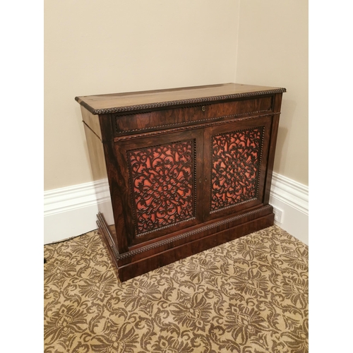 69 - 19th. C. rosewood side cabinet the single drawers above two fretwork panelled doors raised on plinth... 