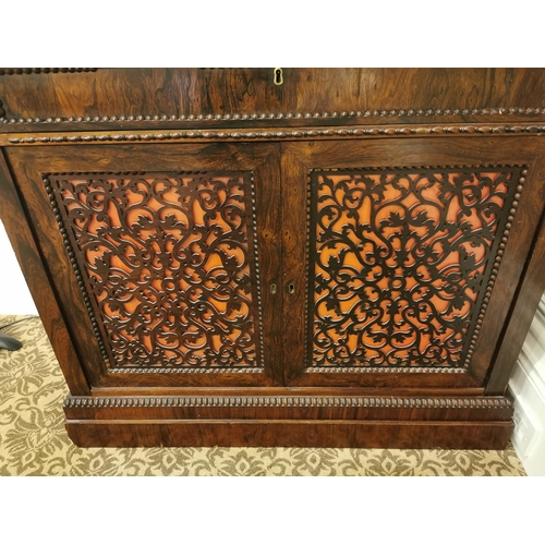 69 - 19th. C. rosewood side cabinet the single drawers above two fretwork panelled doors raised on plinth... 