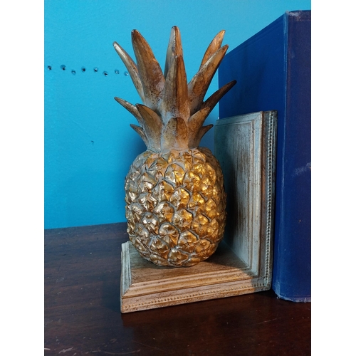 702 - Pair of hand painted wooden bookends in the form of pineapples {17 cm H x 13 cm W x 16 cm D}.