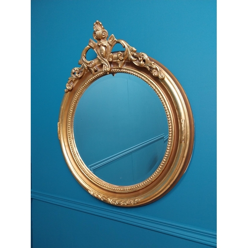 73 - Good quality gilt circular wall mirror with bevelled glass {70 cm H x 60 cm W}.