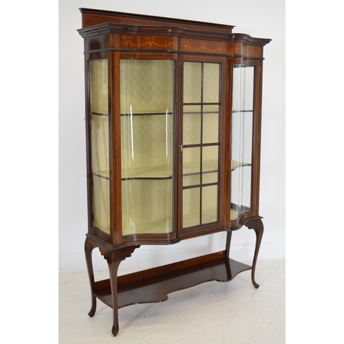 89 - Edwardian mahogany inlaid shaped front display cabinet with one glazed panelled door raised on cabri... 